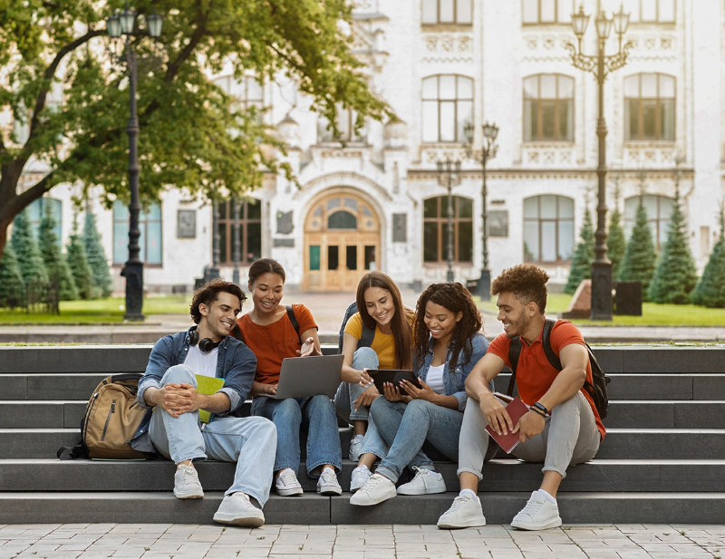 Group of university students spending free time in a park.