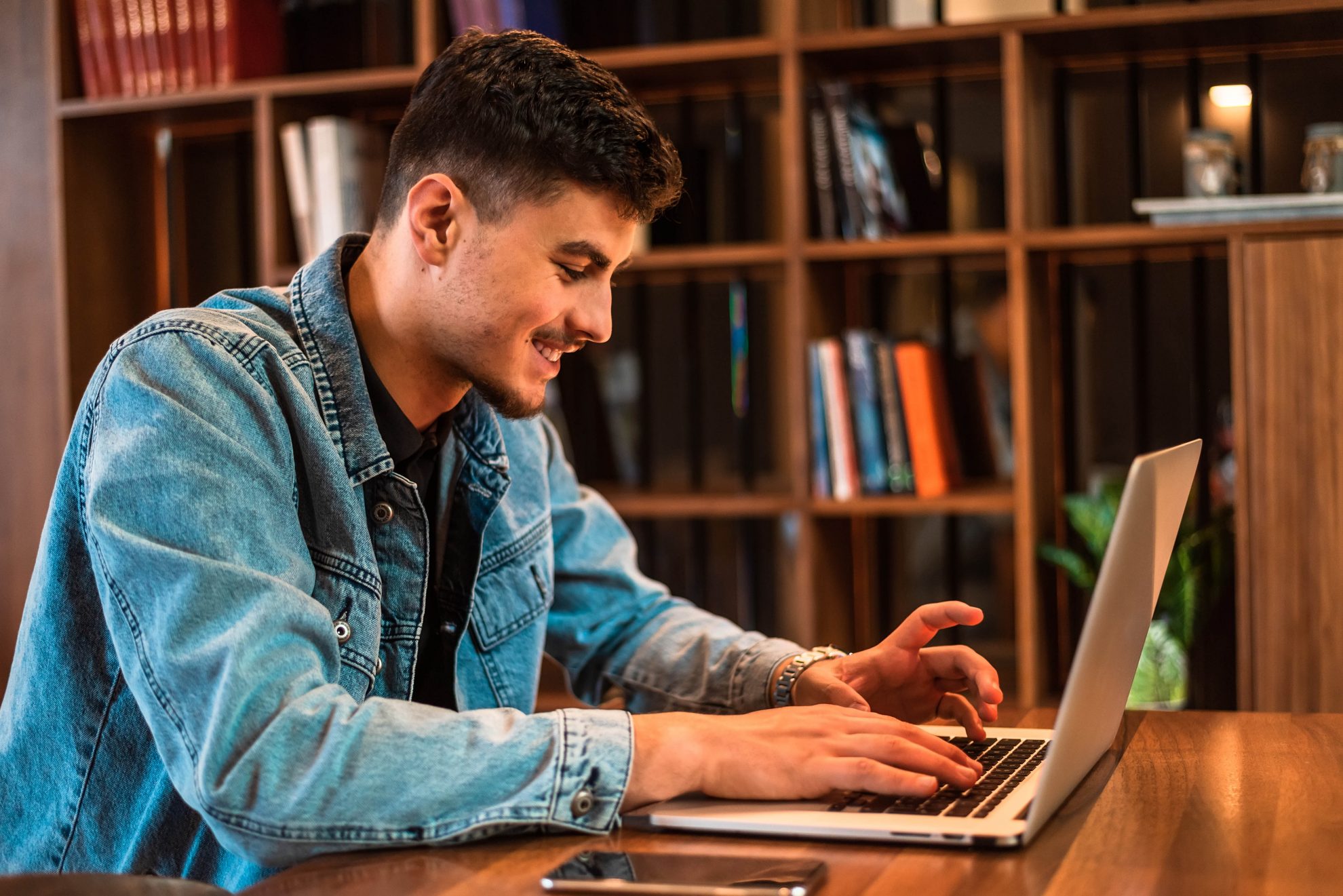 Male college student on university campus with computer laptop. High quality photo